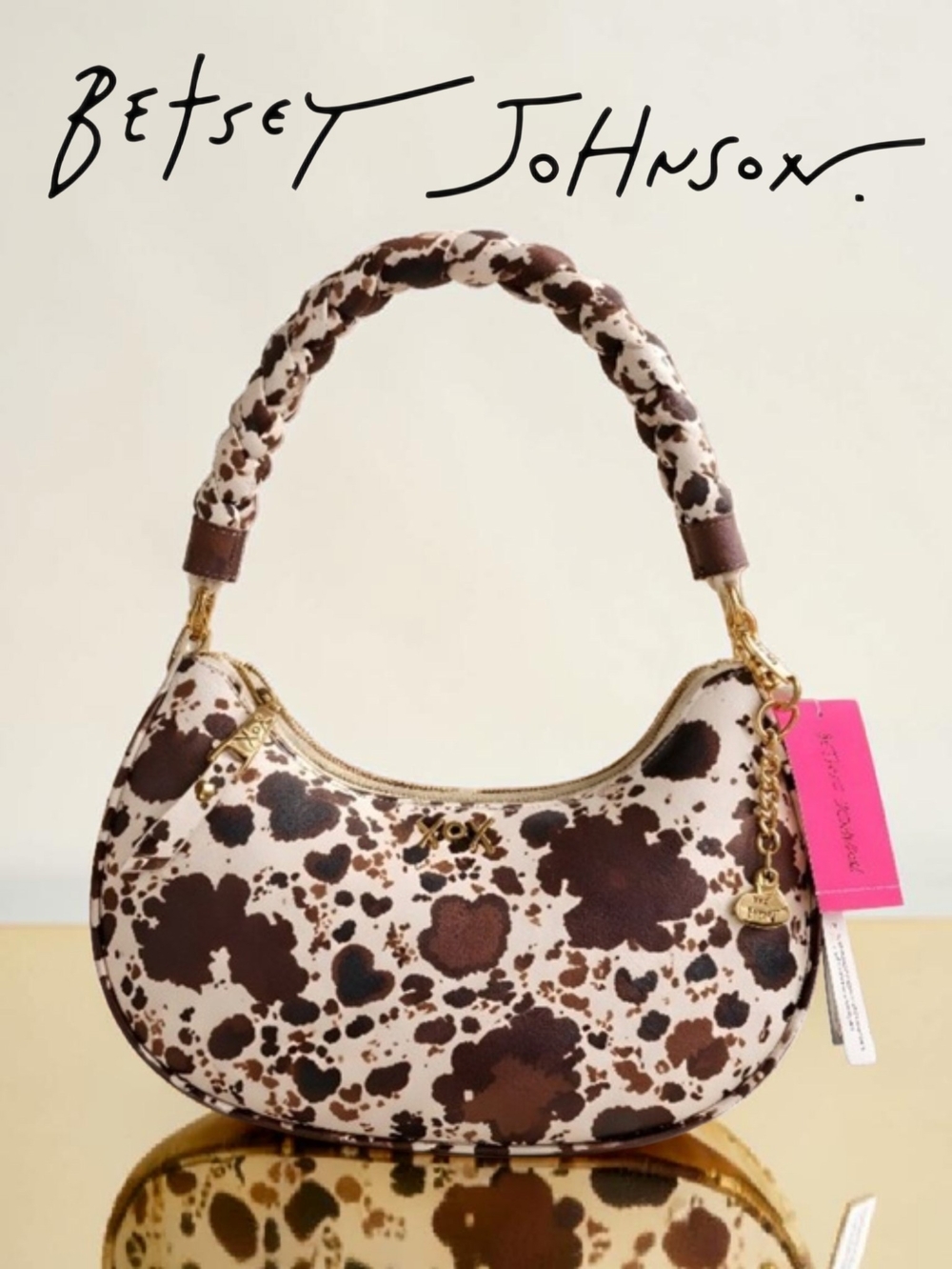 The BETSEY JOHNSON Western Cow Print Brown & White Braided Handle Shoulder Bag